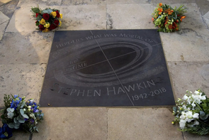 Hawking was interred beneath a stone with the inscription, "Here lies what was mortal of Stephen Hawking," which is an English translation of the Latin words on the nearby grave of Sir Isaac Newton. The stone is also inscribed with one of Hawking's equations describing the entropy of a black hole. (Photo: Ken McAllister) Hawking was interred beneath a stone with the inscription, "Here lies what was mortal of Stephen Hawking," which is an English translation of the Latin words on the nearby grave of Sir Isaac Newton. The stone is also inscribed with one of Hawking's equations describing the entropy of a black hole. (Photo: Ken McAllister)